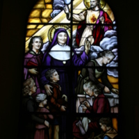 Stained glass window of St Julie and the Sacred Heart